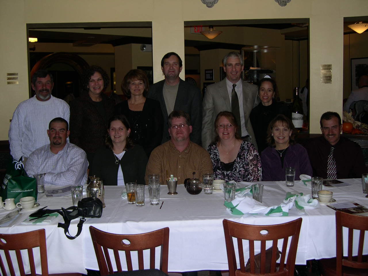 A group of people posing in a restaurant