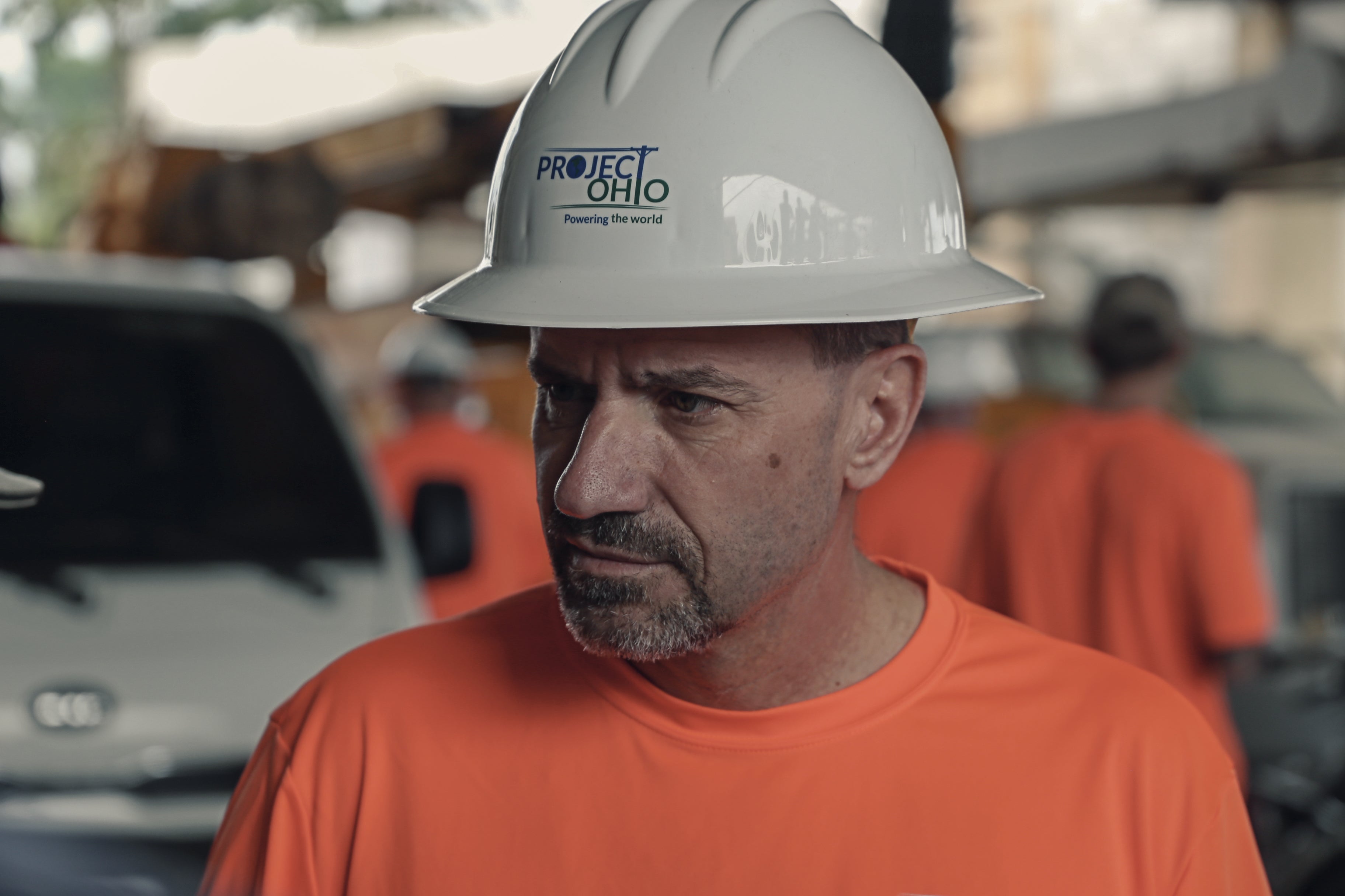 A man talking in a hard hat