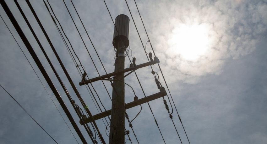 Power line with bright sun