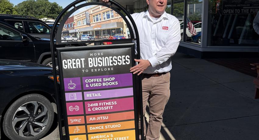 Walking tour guide showing sign